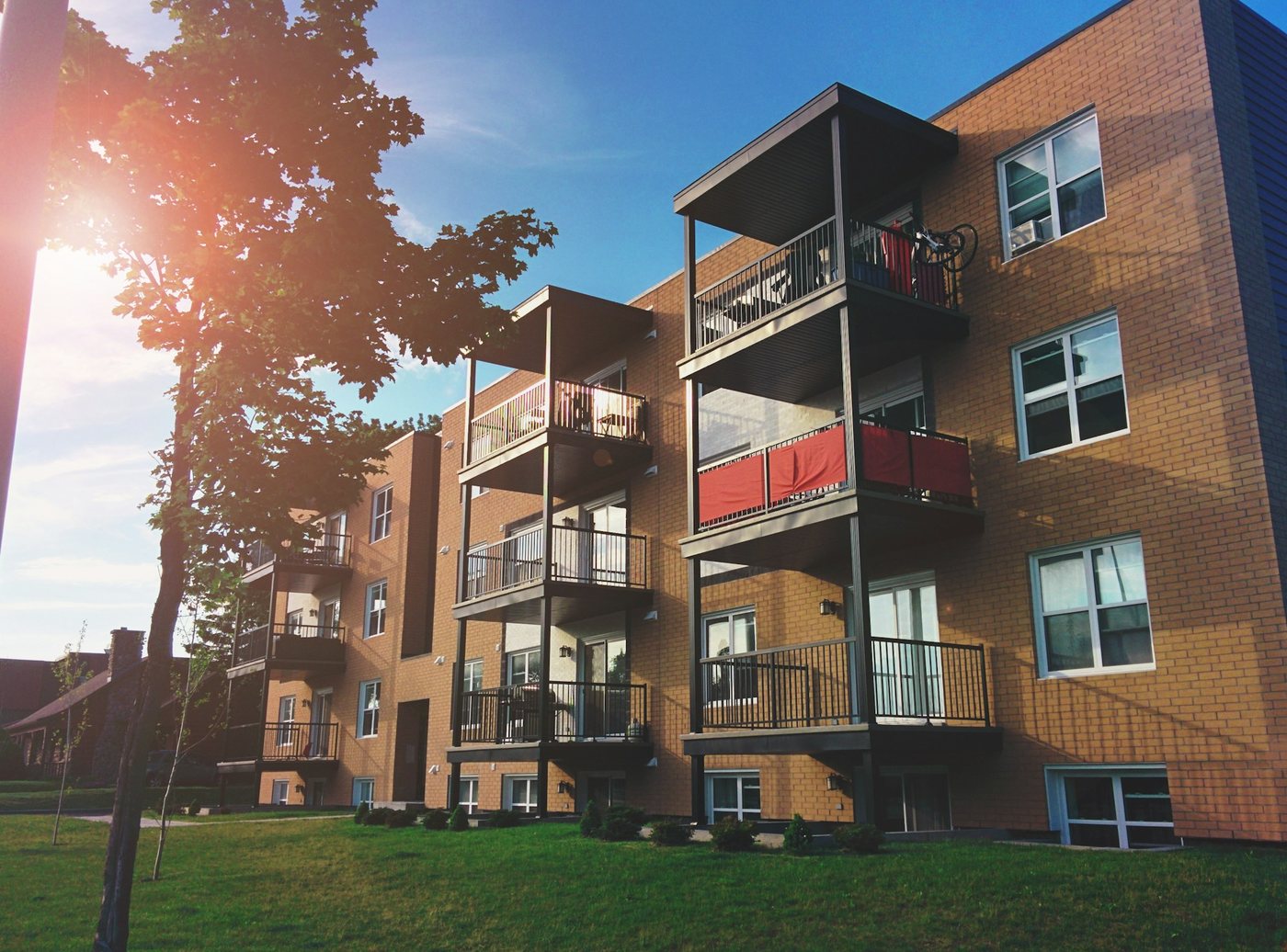 Mid-rise brick apartment building with balconies
